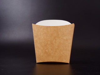 eco-friendly packaging for fast food on a dark background