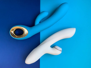 Sex toys. White and blue vibrators on a blue background. Useful for adult, sex shop