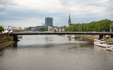 Obraz premium bridge over weser on cloudy summer day moderen building bremen germany