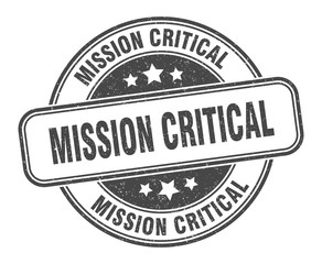 mission critical stamp. mission critical round grunge sign. label
