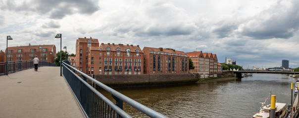 old urban red bricket built houses on teerhof on river weser in bremen