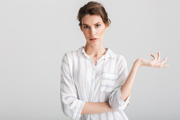 Image of displeased caucasian woman posing and looking at camera