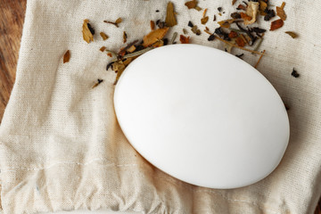 Soap bars with natural ingredients on the table, close up.