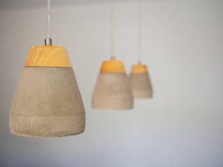 Concrete and wood lamps hanging from ceiling