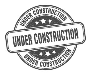 under construction stamp. under construction round grunge sign. label