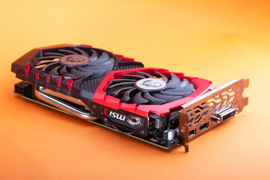 Belgorod , Russia - MAY, 6, 2020: MSI 1050ti Game graphics video card isolated on orange background.