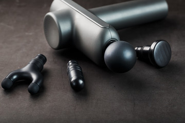 Machine for body massage on a black background.