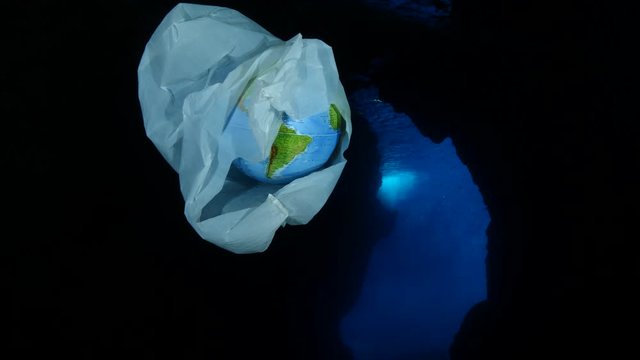 world in plastic bag underwater pollution of rubbish and plastic bag with globe earth quarantine ocean scenery