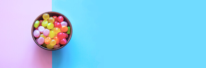 Multicolored candys on a colored background
