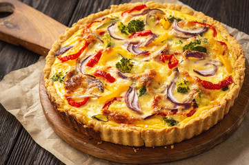 Homemade quiche with vegetables and cheese, vegetarian food.