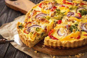 Homemade quiche with vegetables and cheese, vegetarian food.