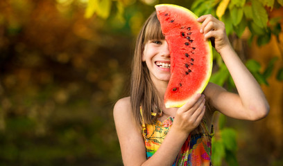 Funny portrait of incredibly beautiful little girl eating watermelon, healthy fruit snack