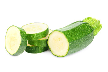 fresh green zucchini with slices isolated on white background.