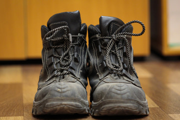 workers boots on a wooden background