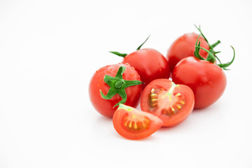 Closeup of tomato white on white background.  Healthy vegan food. Tomato top view. White background. Studio shot. Cherry isolated. Healthy vegetarian food. Cherry set.
