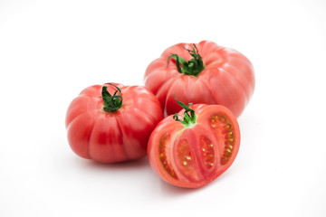 Closeup of tomato white on white background.  Healthy vegan food. Tomato top view. White background. Studio shot. Cherry isolated. Healthy vegetarian food. Cherry set.