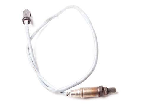 Metal lambda probe is residual oxygen sensor in exhaust manifold of engine or the chimney of heating boiler on white isolated background in a photo studio. Spare part for auto diagnostics and repair.