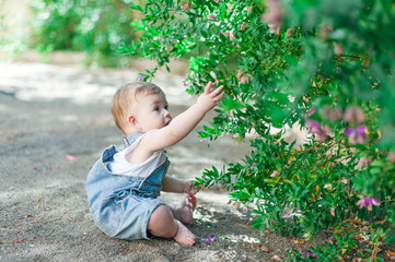 Baby girl playing outdoors