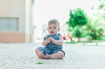 Baby girl playing outdoors