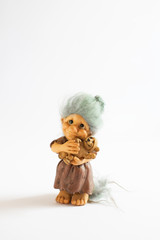 gypsum figurine holding a teddy bear

