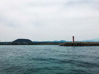 some island and lighthouse and Sky