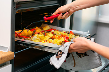 Cooking in the kitchen in the electric oven. Electric oven with hot air ventilation. New oven. Cooking at home