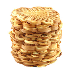 freshly baked homemade waffles stacked in a stack on a plate isolated on white background