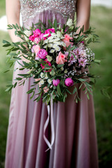 Bride in a dress with a wedding bouquet