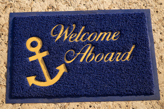 Welcome aboard blue mat. Beach cafe, yacht club Wellcome concept