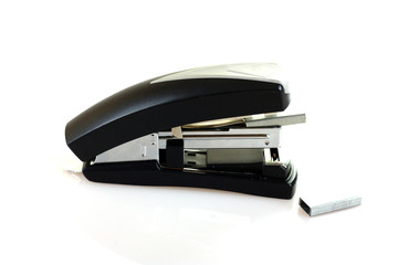 Black colored stapler shot with staples.