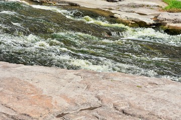 The rapid flow of a mountain river near granite canyon Buki Cherkasy region, Ukraine. Ukrainian landmarks. Nature reserve.  Sights of Ukraine. Stone coast 