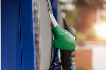 Close up petrol pump filling nozzles at the gas station. Benzine, diesel.