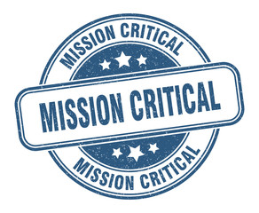 mission critical stamp. mission critical round grunge sign. label