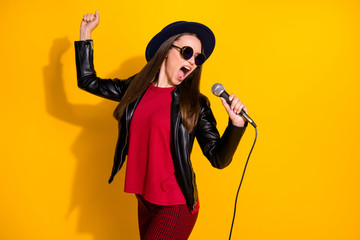 Portrait of her she nice-looking attractive lovely pretty fashionable cheerful straight-haired girl singing karaoke performing isolated over bright vivid shine vibrant yellow color background