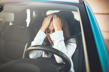 I can't believe I failed another driver's test. Cropped shot of a young woman looking stressed-out...