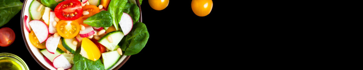 Concept of healthy food, clean eating, dieting. Colorful fresh vegetable salad in a bowl. Easy to cook, perfect summer light meal. Black background copy space for text and design. Banner