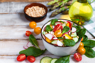 Concept of healthy food, clean eating, dieting. Colorful fresh vegetable salad in bowl. Easy to...