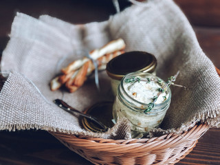 Flavored butter with herbs and grissini sticks