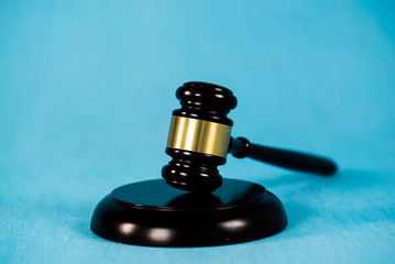 Law and court. Lawyer, attorney, judge concept. Judge gavel on blue background 