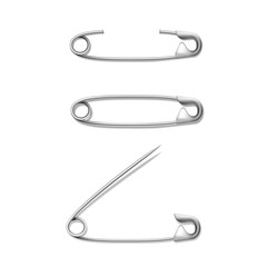 Set of attached to fabric, paper fastened, closed, opened silver or stainless steel safety pins.