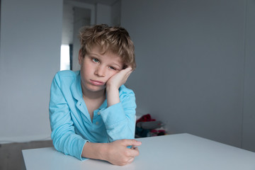 boy feeling anxiety and stress, kid staying home