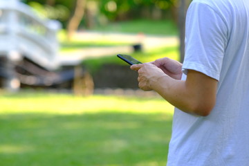 Young man using a smartphone working in home and Online shopping, freelance, online learning, worked at home office concept