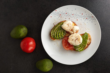 How to cooking a homemade toast with avocado, eggs, tomato and seeds. Step by step instruction. Step 5