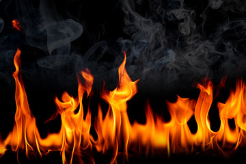 Fire flames with smoke on black background, Burning red hot sparks rise, Fiery orange glowing flying particles