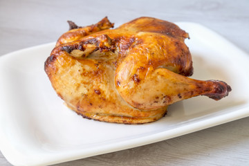 whole roasted chicken isolated on white background