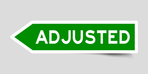Green color arrow sticker with word adjusted on gray background © bankrx