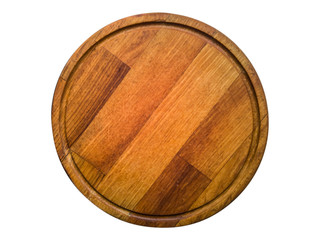 Round wooden kitchen board isolated on white.