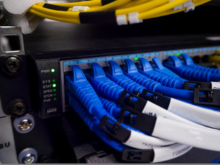Computer Network Telecommunication Ethernet Cables Connected to Internet Switch.