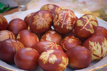 Easter eggs with leaf patterns on the table