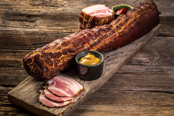 Delicious artisanal whole smoked slab bacon. product from organic farm, produced by traditional...
